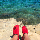 red brighton beach shoes on rocks